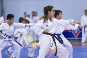 martial arts students of different levels training in class together