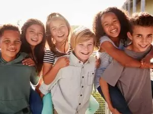 group of kids posing together enjoying their summer break